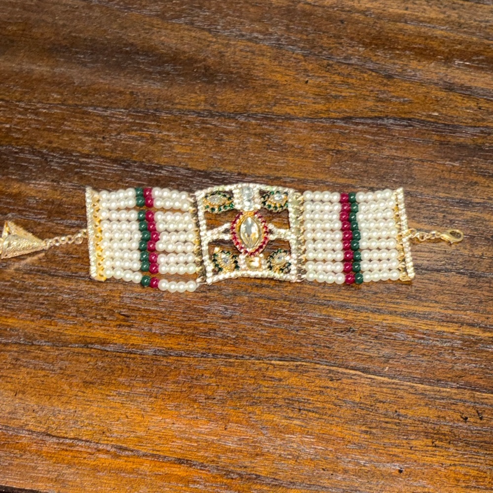 Elegant Gold and Red Pearl Bracelet